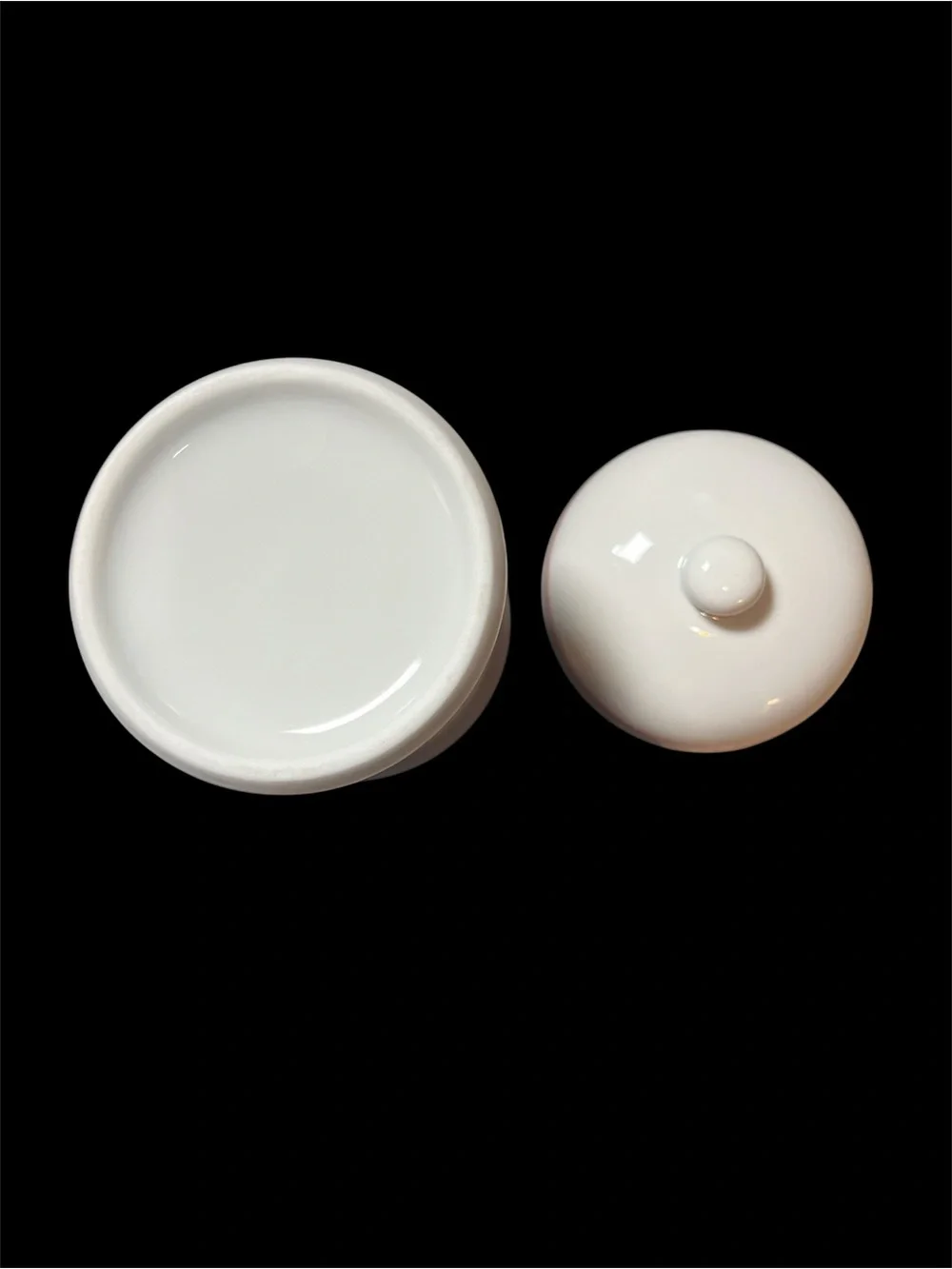 This is a vintage 1987 Avon white porcelain apothecary jar